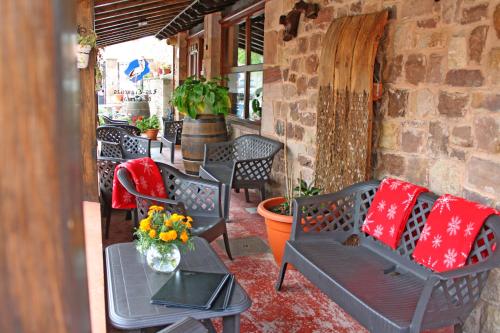 a group of chairs and tables on a patio at Posada Ormas in Ormas
