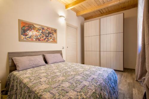 Postel nebo postele na pokoji v ubytování Grazioso Bilocale La Casa di nonna