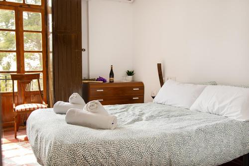Postel nebo postele na pokoji v ubytování HOTEL BODEGA VERA DE ESTENAS