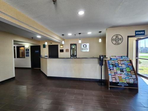 a lobby of a store with a counter and a pharmacy at Quality Inn I-70 at Wanamaker in Topeka