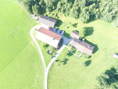 an aerial view of a house in a field at Ferienparadies Fuchsloch in Waakirchen