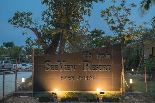 a sign for the seymour research manthan of first at night at SeeView Resort (ซีวิว รีสอร์ต) in Ban Pak Nam