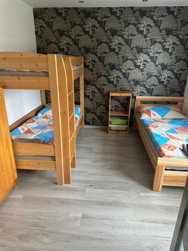Posteľ alebo postele v izbe v ubytovaní W Apartmány 3