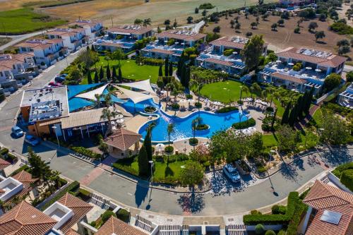 an aerial view of a resort with a pool at Atlantis Gardens in Mazotos