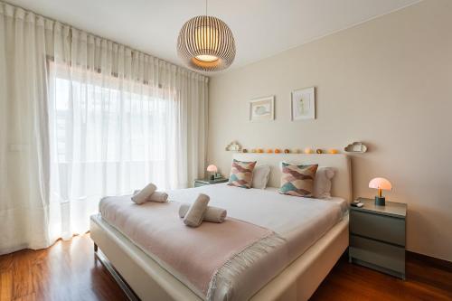 En eller flere senge i et værelse på GuestReady - Teddy Jazz