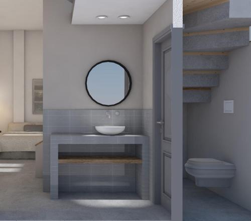 a bathroom with a sink and a mirror at Athos Villas in Ouranoupoli