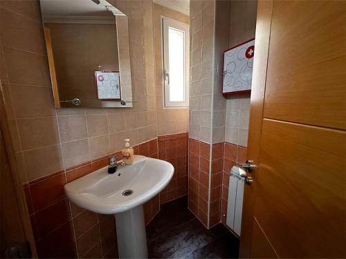 a bathroom with a sink and a mirror at Casa Vila in Riópar
