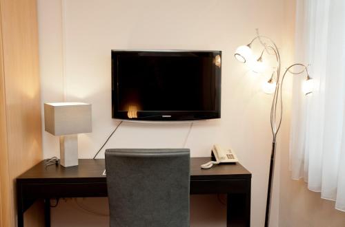 TV a/nebo společenská místnost v ubytování Simply Rooms