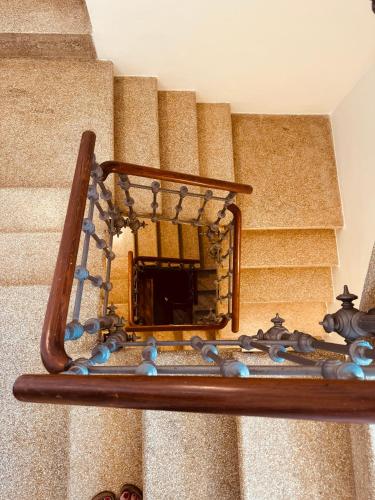 a mirror on the side of a set of stairs at Borgo Rosalia in Galatina