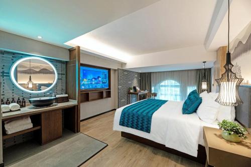 a bedroom with a large bed and a bathroom at Mehood Lestie, Xiamen Zhongshan Road Pedestrian Street in Xiamen