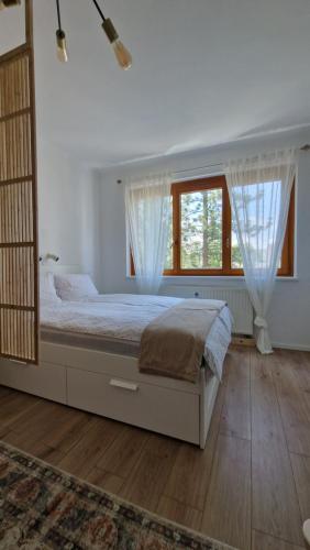 Postel nebo postele na pokoji v ubytování Cosy Apartment with a Magnificent View