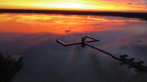 an aerial view of a body of water at sunset at Ferienhaus Lion in Neustadt-Glewe