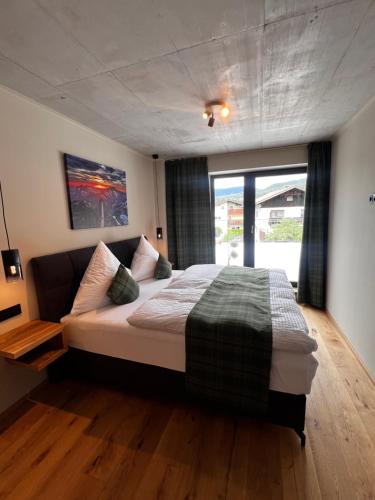 Postel nebo postele na pokoji v ubytování Hoisler's Appartements