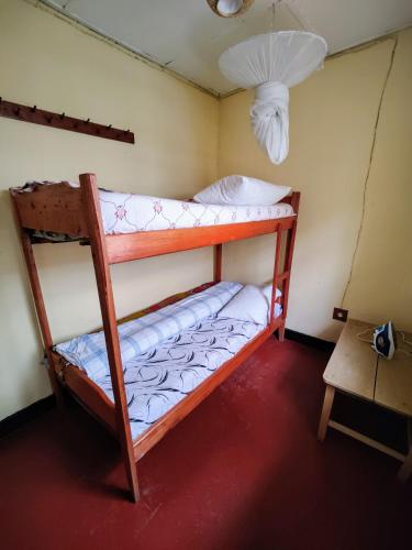 Ένα ή περισσότερα κρεβάτια σε δωμάτιο στο Amahoro Guest House