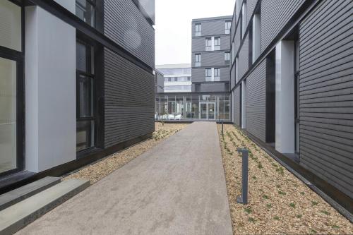 a walkway between two buildings in a building at Student Factory Lille Euratechnologies in Lille