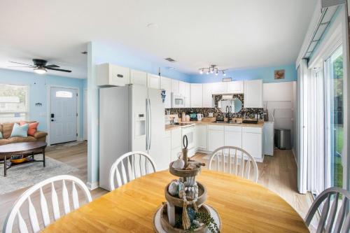 a kitchen and dining room with a table and chairs at Charming 3BR Home with Free Parking & Game Room in Panama City