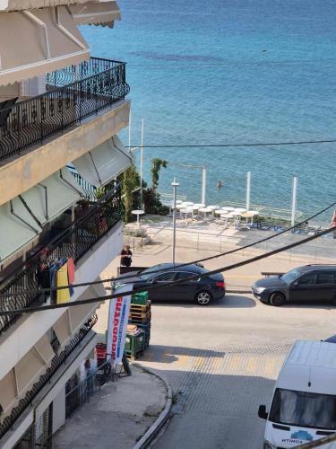 a balcony of a building with a view of the ocean at Lara Sea View apartment in Nea Kalikratia