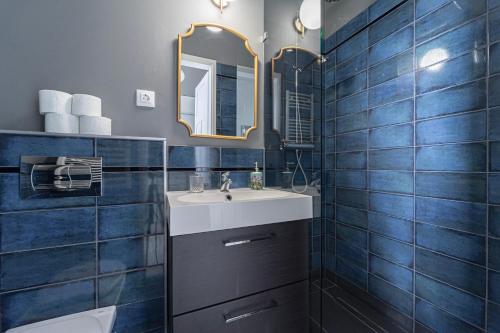 a bathroom with a sink and a mirror at Heart of City in Budapest