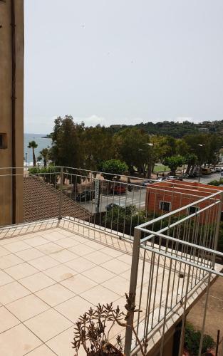 a balcony of a building with a view of the ocean at Orizzonte House, Cilento Coast, Sapri in Sapri