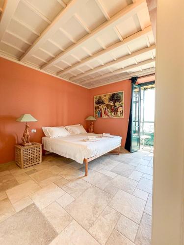 a bedroom with a bed in a room with orange walls at Montecatini Alto Art View in Nievole