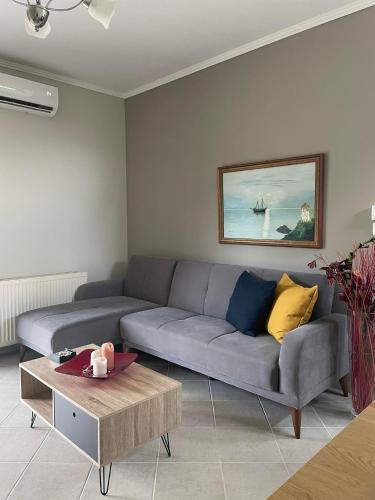 a living room with a couch and a table at Village Experience in Xanthi
