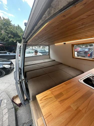 an empty back of a boat with a wooden floor at Boba rent van in Tirana