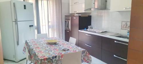 a kitchen with a table with a bowl on it at Puffetta in Pachino