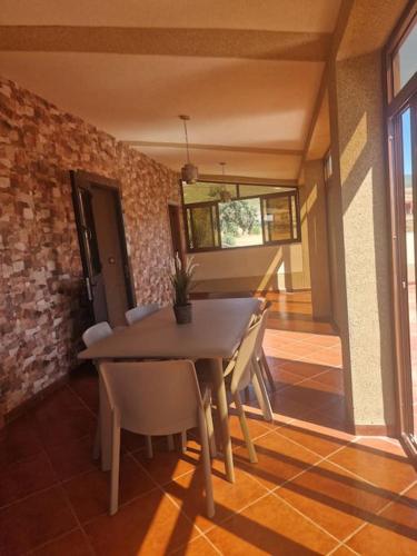 a dining room with a table and chairs at Villa Fatma in Haraka