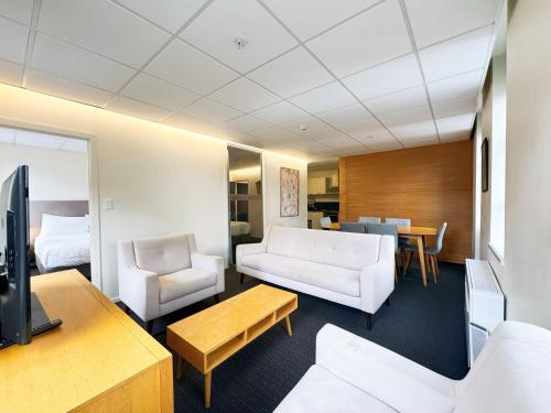 a living room with a couch and a table at Park Hotel, Lambton Quay in Wellington