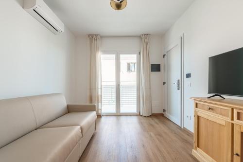 TV o dispositivi per l'intrattenimento presso Olbia Rooms