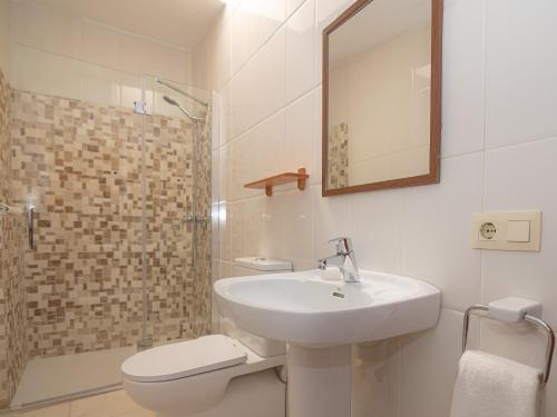 a bathroom with a sink and a toilet and a shower at 273 Villa Joy ETV99 by Mallorca Charme in Llubí
