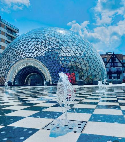a fountain in front of a large dome building at Royal Knokke in Knokke-Heist
