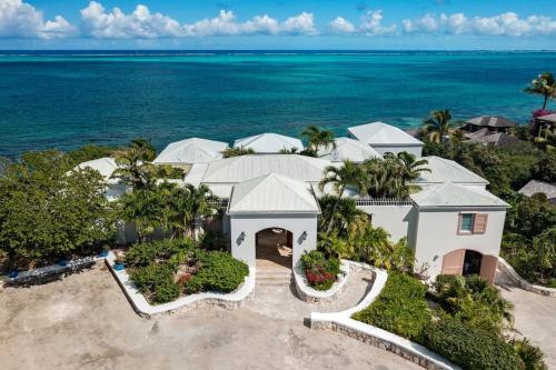 an aerial view of a house on the beach at Reef Tides Luxury Beach House in Providenciales