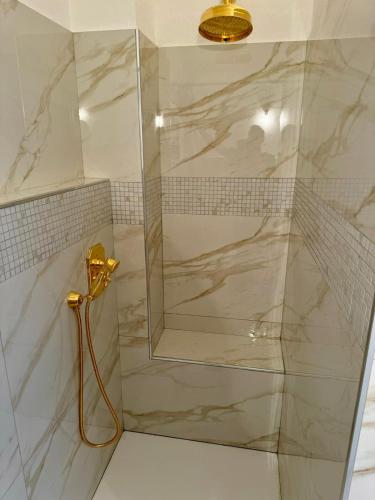 a shower with a glass door in a bathroom at Lago Bello in Stresa