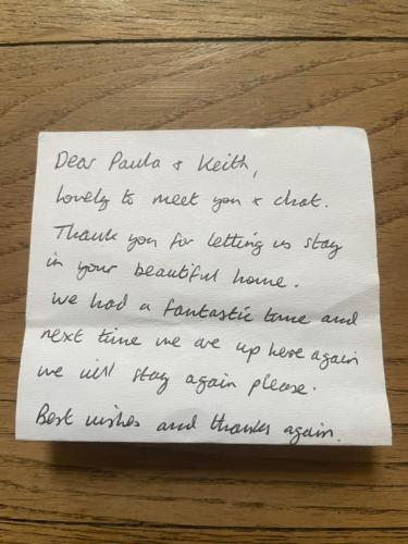 a piece of paper sitting on top of a table at Highthel Holiday Home by the Northumberland Coast in Morpeth