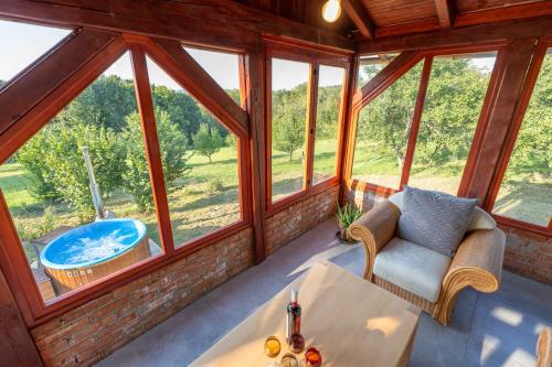 a room with a view of a tub in a house at Holiday Home Anka in Vojnić