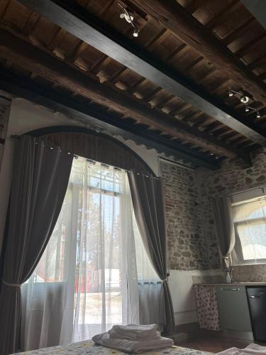 a bedroom with a bed with a window at Ca'Silvia in San Savino