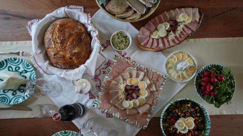 a table with plates of food on a table at Mühlbauerhof in Großklein