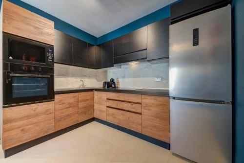 Urban Square Elite Residences by 360 Estatesにあるキッチンまたは簡易キッチン