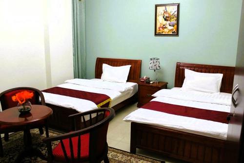 Postel nebo postele na pokoji v ubytování Bahla Hotel Apartments