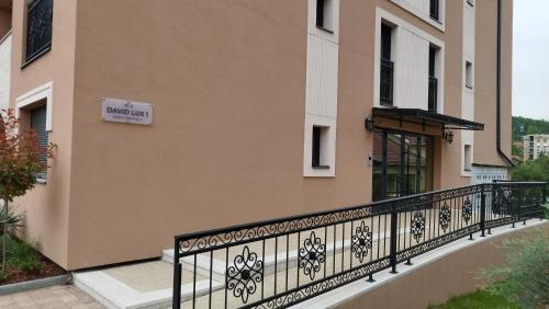 a balcony of a building with a sign on it at Apartmani Lucky Place in Vrnjačka Banja