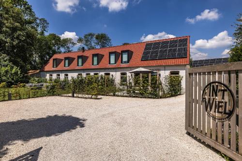 a house with solar panels on top of it at In 't Wiel Oudenaarde in Oudenaarde