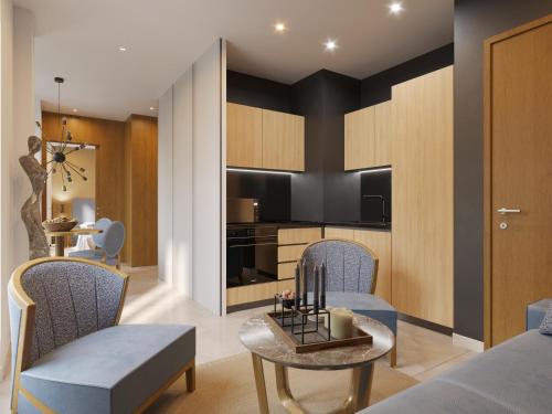 a living room with a bed and a table and chairs at Résidence Aston la Scala in Nice