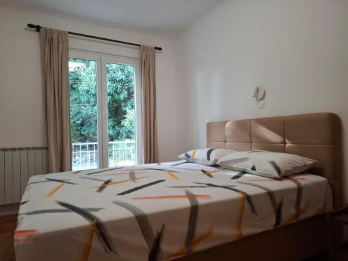 Ένα ή περισσότερα κρεβάτια σε δωμάτιο στο Apartment Grando