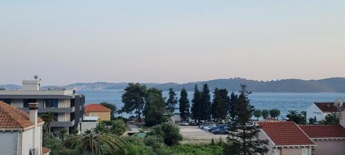 a view of a city and the water at Summer Park Residence Peljesac in Orebić