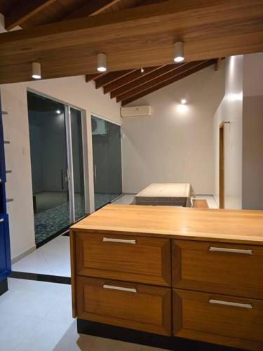 a room with a wooden counter top in a room at Confortável como a sua casa! in Ariquemes