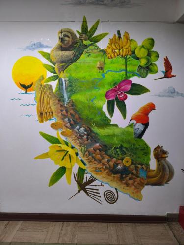 a mural on a wall with birds and flowers at Alojamiento San Francisco - Apartamentos y habitaciones in Lima