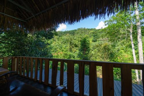 a view from the deck of a cabin at Ha Giang Xanh Retreat - Trekking, Tour, Motorbike Rental in Ha Giang