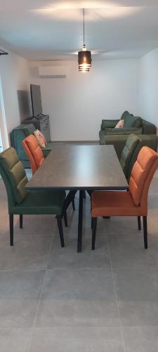 a table and chairs in a living room at Villa Irene in Veli Lošinj