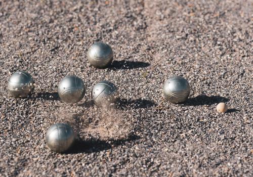 a group of balls sitting on the sand at Lixus Beach Resort - All In in Larache
